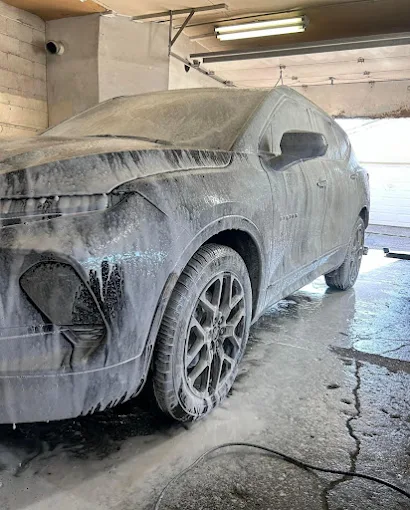 Black Audi R8 sports car in garage after detailing