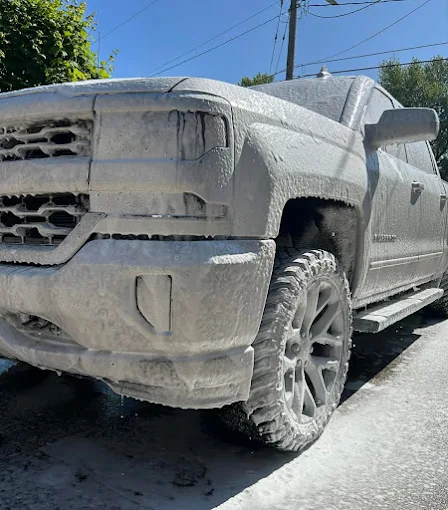 Truck covered in foam during detailing
